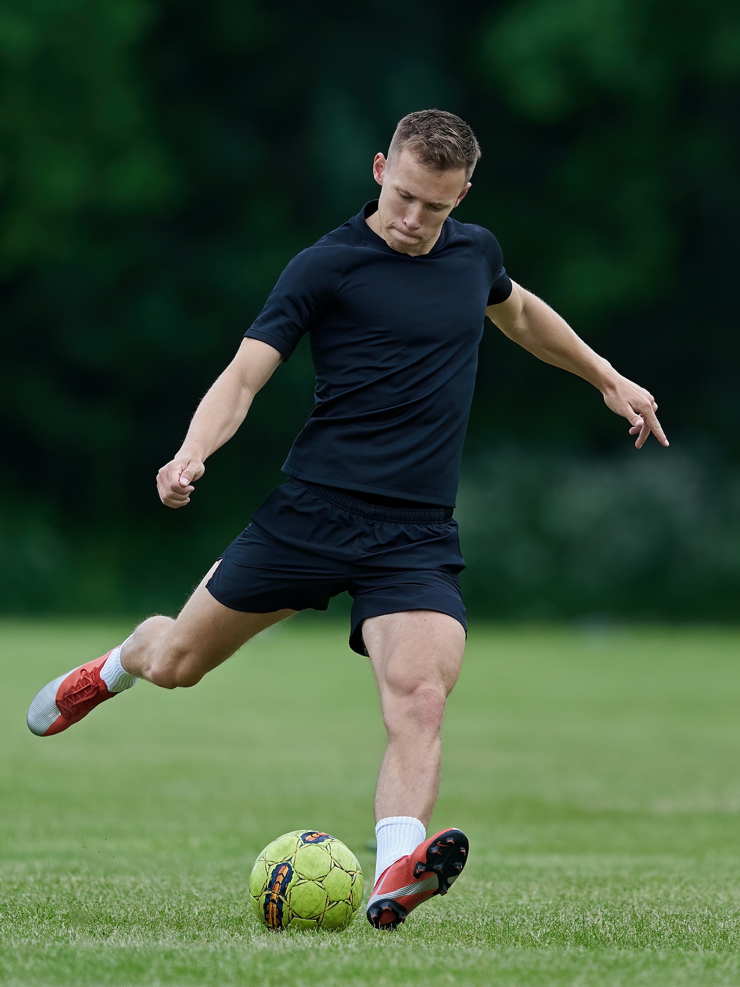 Football player kicking a ball